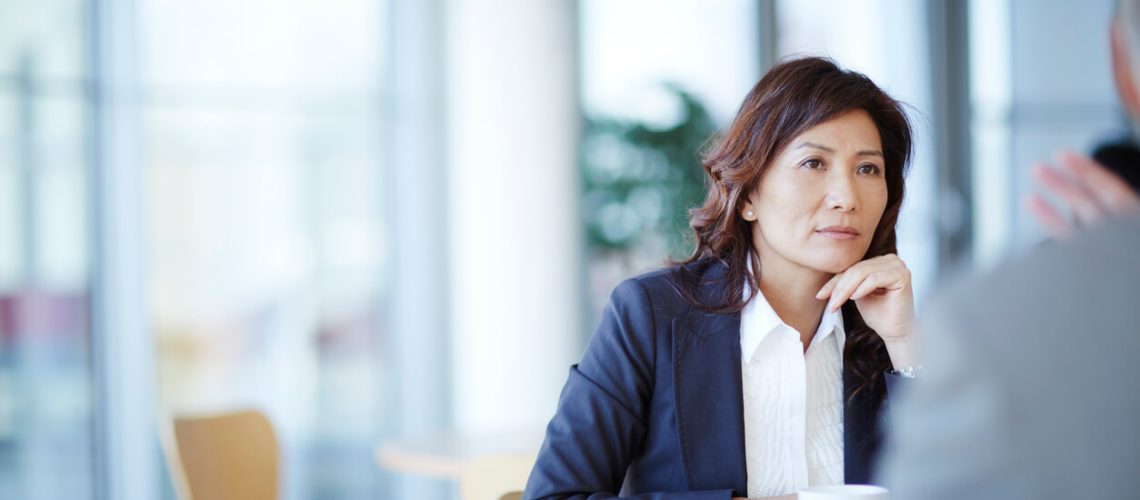 do you have to exchange insurance details after an accident - The Sorenson Law Firm - Woman exchanging insurance details after Arizona car accident